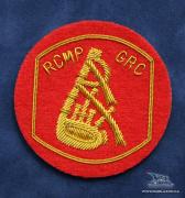  EE-045R - RCMP Piper Appointment Badge - Gold on Red 